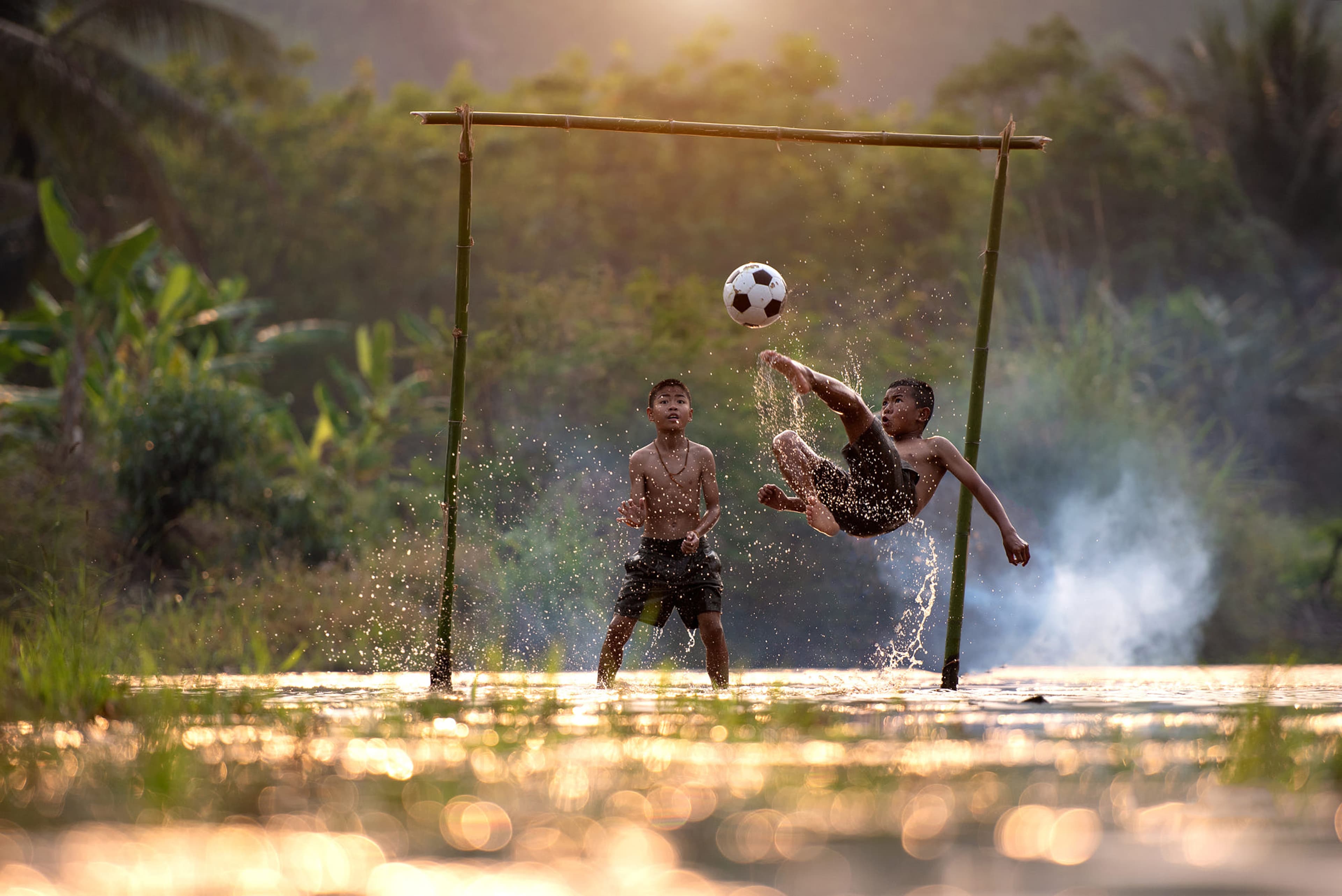 children playing football